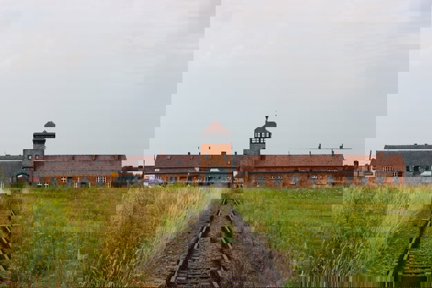 View of Auschwitz building from a train track