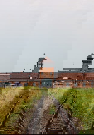 View of Auschwitz building from a train track