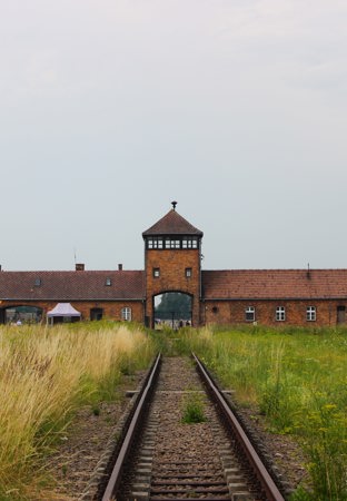 View of Auschwitz building from a train track