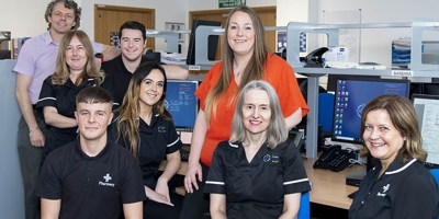 Photo of a pharmacy team in an office