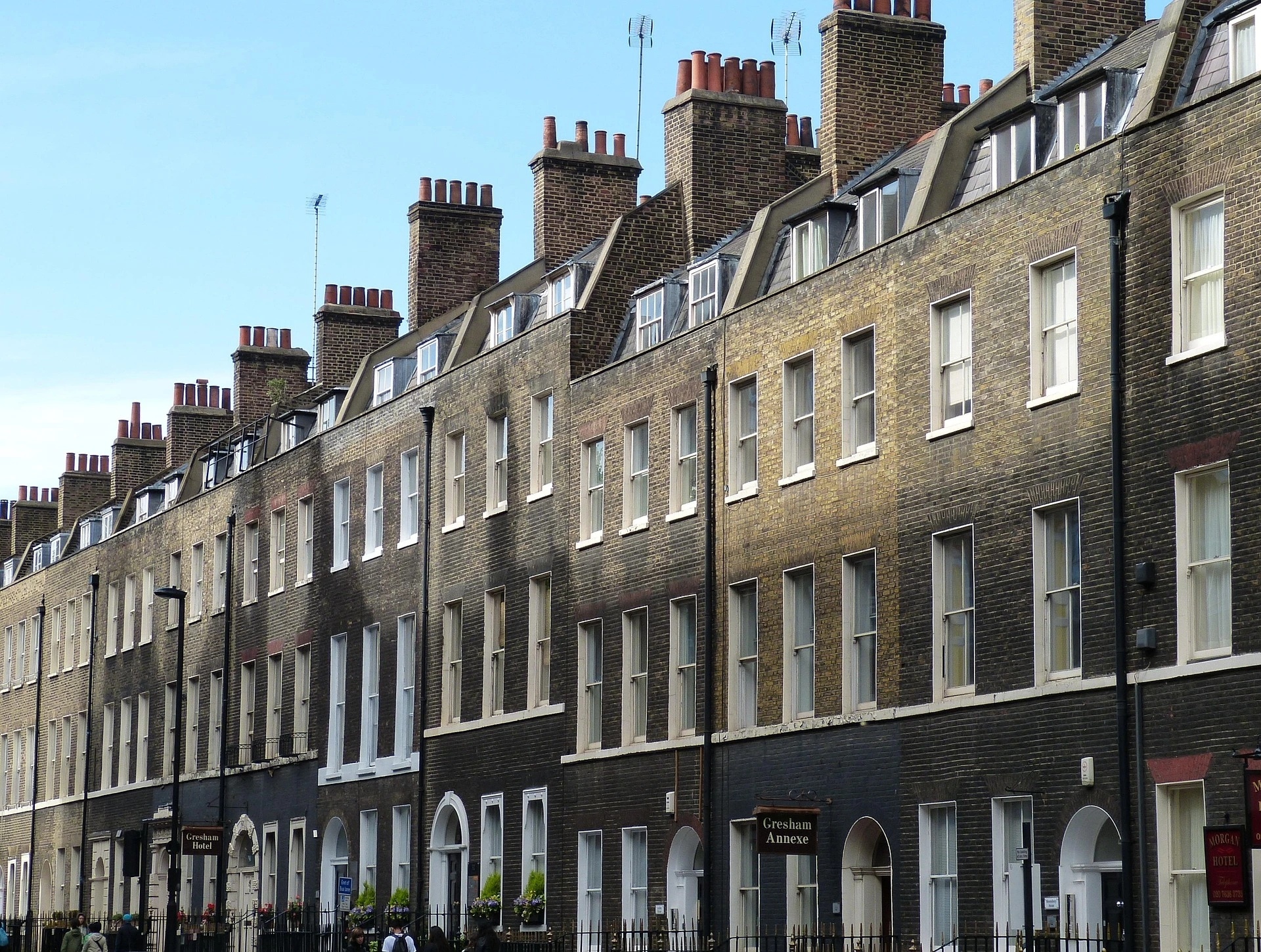 Row Of UK Terraced Homes Representing Social Housing And Housing Services
