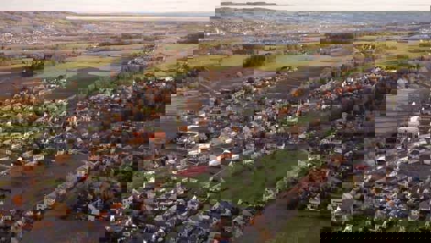 Landscape view of urban area and fields